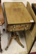 A 19th Century mahogany drop leaf Pembroke type work table with two drawers on twin pedestal