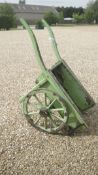 A vintage hand cart with iron bound wheels
