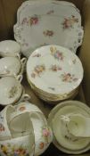 A Coalport relief decorated and floral spray printed and painted part tea service (12 place