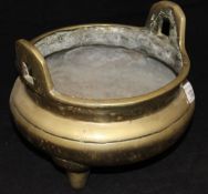 A 19th Century Chinese brass censer with 16-character mark to base on three cylindrical legs