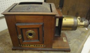 A mahogany and painted tin magic lantern projector by Perken, Son & Rayment of London,