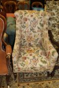 A 19th Century armchair in cream ground foliate pattern upholstery,