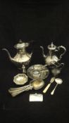 A collection of various plated wares including water jugs, cream jugs, lidded mustard, open salt,