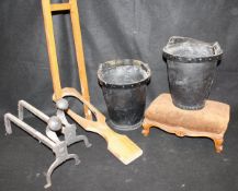 A pair of leather water buckets, a pair of iron fire dogs, two wrought iron and wire fire guards,
