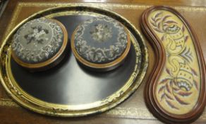 A pair of circular walnut and inlaid needlework and beadwork topped circular stools,