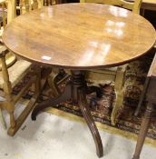 An early 19th Century drop-leaf Pembroke table with single end drawer opposite a dummy drawer on