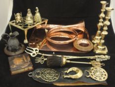 A box of copper and brass wares to include copper tray, pair of brass candlesticks,