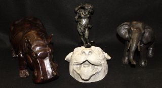 A spelter figure of an elephant and of a putti,