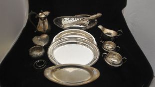 A collection of various silver and plated wares to include a George V silver sugar bowl and creamer