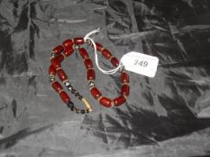 A vintage red amber bead,