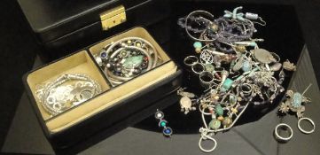 A leather jewellery box and contents of various costume jewellery, mainly white metal,