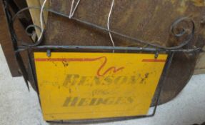 A Benson & Hedges enamel painted sign in a shop hanging fitting,