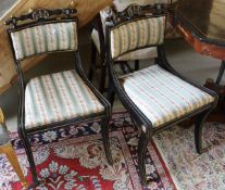 A set of four Regency style ebonised and gilt decorated dining chairs together with a further