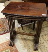 A modern mahogany nest of three tables with applied moulded edge together with a middle eastern