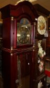 A modern mahogany long case clock with brass dial together with an early 20th Century oak long case