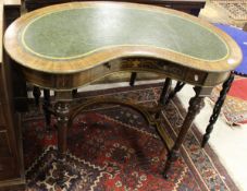 An Edwardian rosewood and inlaid kidney shaped writing table,