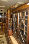 A collection of furniture comprising a modern and astragal glazed two door display cabinet,