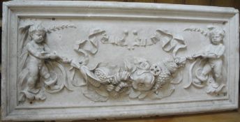A plaster wall plaque decorated with putti hanging a swag with garlands and three Victorian dining