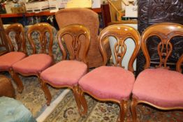A set of six mahogany framed Victorian dining chairs with pink upholstered seats on cabriole legs