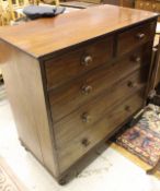 A Victorian mahogany chest of two short over three long graduated drawers on turned feet
