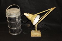 An anglepoise lamp by Herbert Henry with a two-stepped base,