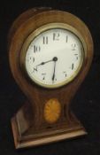 A mahogany cased balloon shaped mantel clock with Swiss made Beuren movement with Arabic numerals
