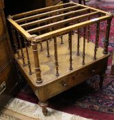 A Victorian walnut four section canterbury,
