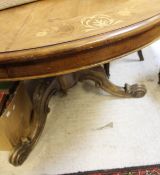 A Victorian mahogany and inlaid breakfast table raised on pedestal base to tripod legs together