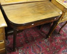 A 19th century mahogany tea table of rectangular form, the plain top with rounded corners,