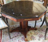 A modern octagonal centre table with marble and brass inlaid top to architectural pedestal on