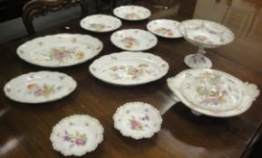 A Meissen part dinner service with floral spray decoration and shaped edge with gilt lining