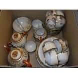 A Japanese eggshell china part tea service decorated with geishas and garden comprising tea cups,