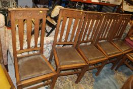 A set of six oak framed early 20th Century dining chairs,