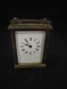 A 20th Century lacquered brass cased carriage clock,