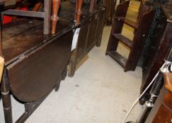 An 18th Century oak coffer with shallow carved decoration together with an oak drop leaf table and