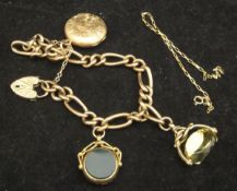 A 9 carat gold charm bracelet with various seals and locket and a thin rectangular link 9 carat