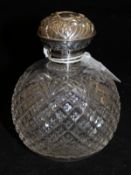 A George V pineapple cut glass and silver mounted dressing table scent bottle of grenade form,