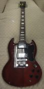 A "Vintage" Gibson six string electric SG copy guitar in soft case,