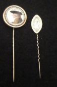 An early 19th Century mourning stick pin, the panel of navette form,