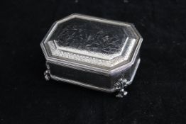 A George V silver dressing table box of elongated octagonal form,
