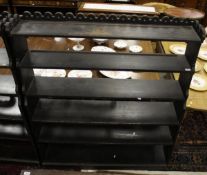 A pair of ebonised open shelf units in the Victorian gothic revival taste,