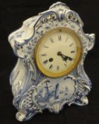 A blue and white faience cased mantle clock,