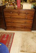 A circa 1900 mahogany chest of two short above three long drawers with turned handles to plinth
