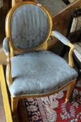 A Louis XV style spoon back armchair with gilt decoration