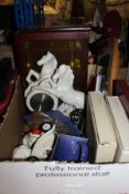 A box of various ornamental wares "Prancing Horses" clock, souvenir spoons, wall mounted barometer,