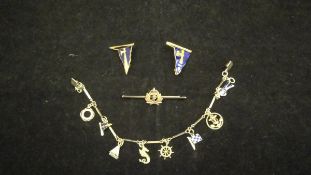 A 9 carat gold charm bracelet set with ten various charms of a maritime nature,