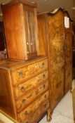 An early 20th Century walnut bedroom suite comprising five drawer chest,