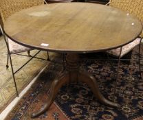 A 19th Century oak tilt top table,