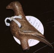 A circa 800 BC North West Persian cast bronze pendant in the form of a standing falcon,
