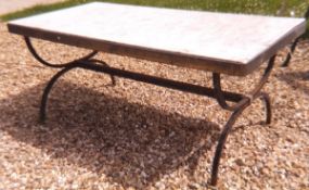 A large marble topped table raised on a wrought iron base CONDITION REPORTS Approx.